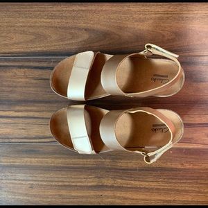 Gold Clark’s Auriel Fin wedge sandals